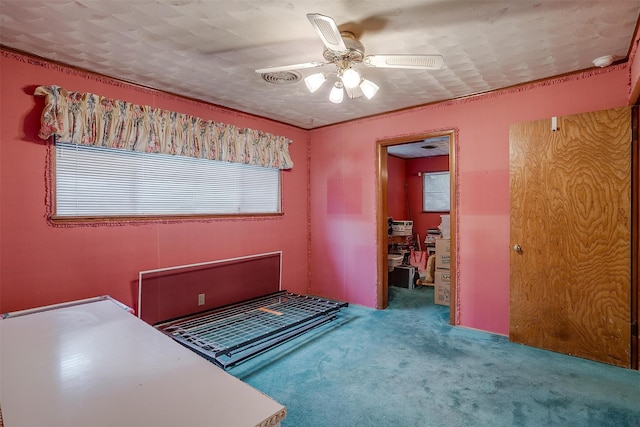 unfurnished bedroom featuring carpet flooring and ceiling fan