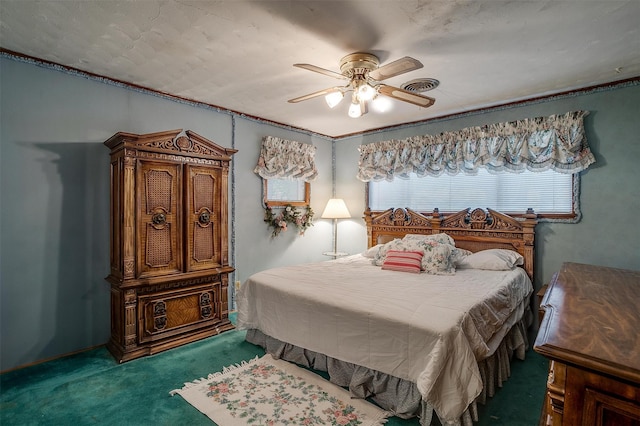 bedroom featuring a textured ceiling, carpet, and ceiling fan