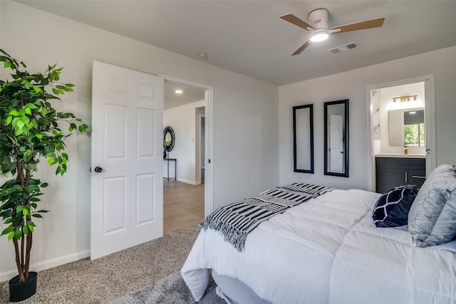 carpeted bedroom featuring ceiling fan and connected bathroom