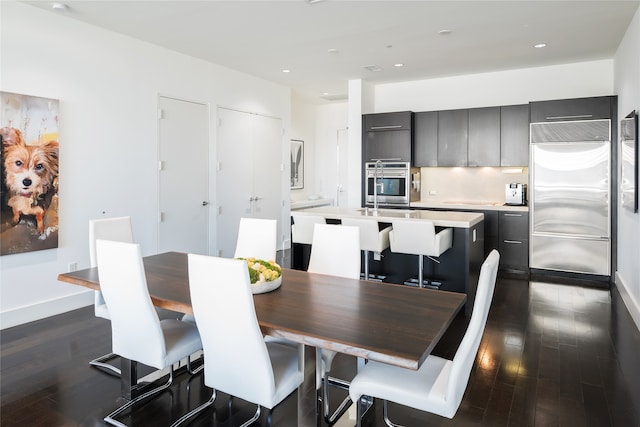 dining area with dark hardwood / wood-style floors