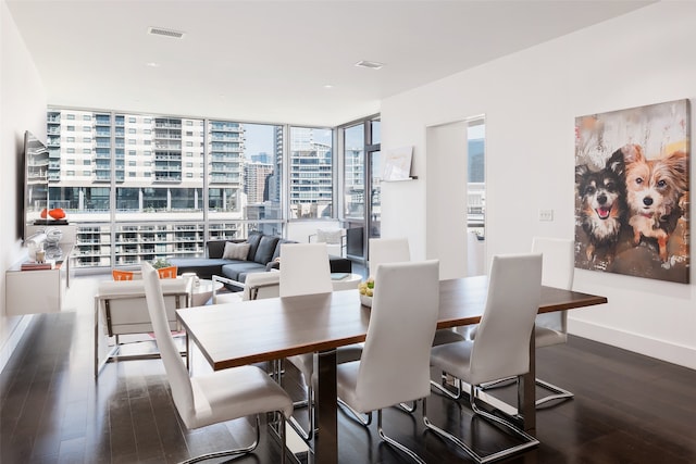 dining room with expansive windows and dark wood-type flooring