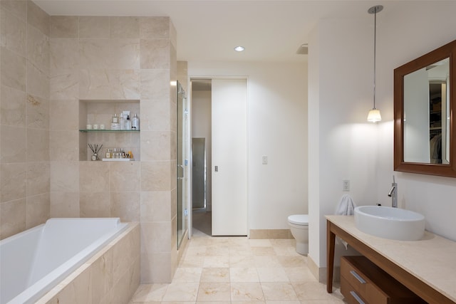 full bathroom featuring vanity, toilet, and separate shower and tub