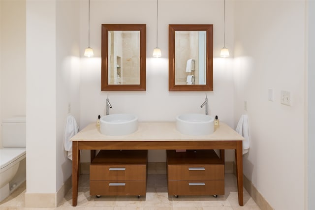 bathroom with toilet and vanity