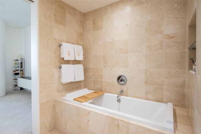 bathroom with a relaxing tiled tub