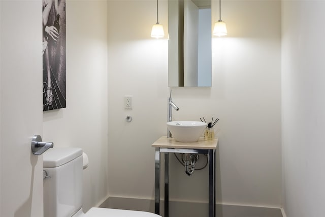 bathroom with sink and toilet