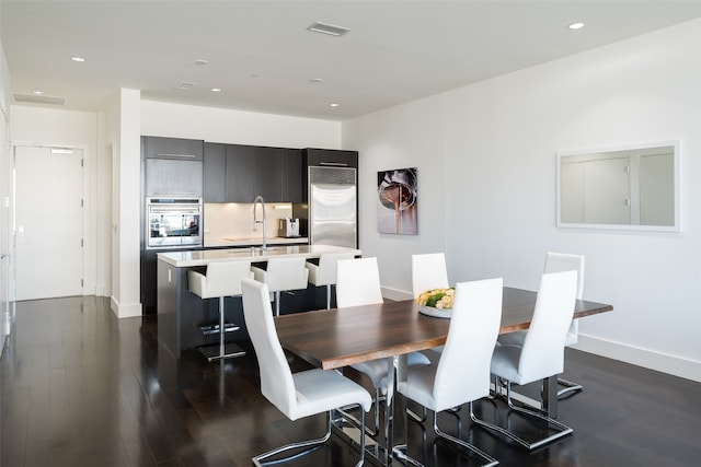 dining area with dark wood-type flooring