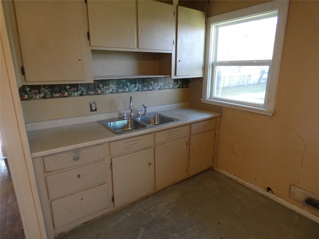 kitchen with sink and cream cabinetry