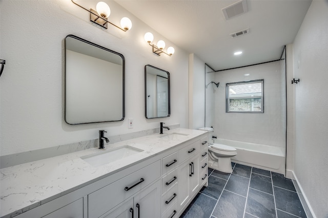 full bathroom featuring toilet, vanity, tile patterned floors, and tiled shower / bath