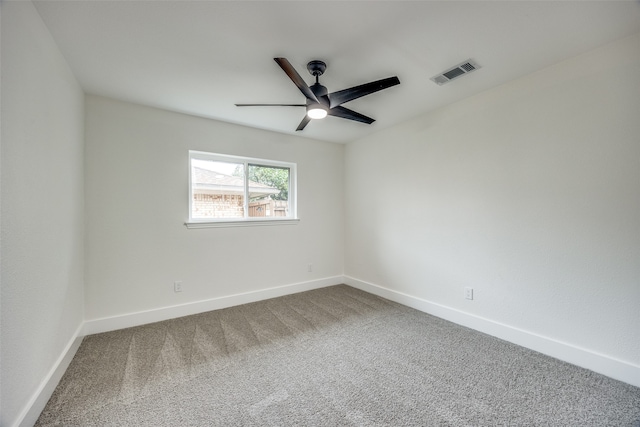 spare room with ceiling fan and carpet floors