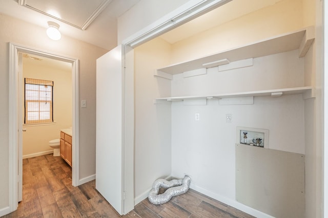 laundry area featuring washer hookup, dark hardwood / wood-style floors, and hookup for an electric dryer