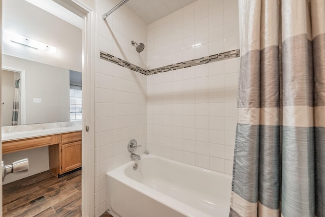 bathroom featuring hardwood / wood-style floors, vanity, and shower / bathtub combination with curtain