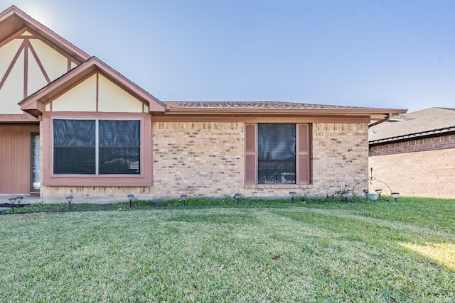 view of property exterior with a lawn