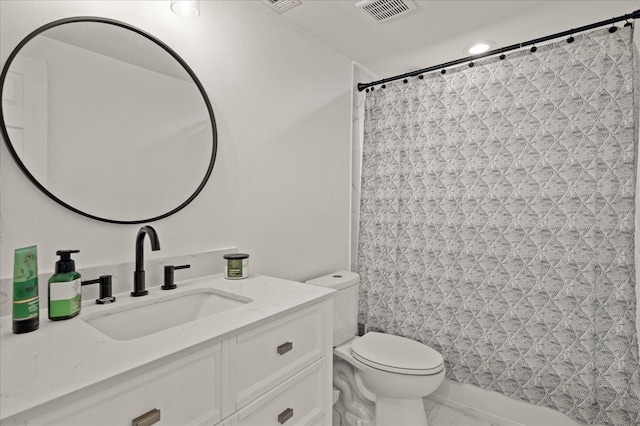 bathroom with a shower with curtain, vanity, and toilet