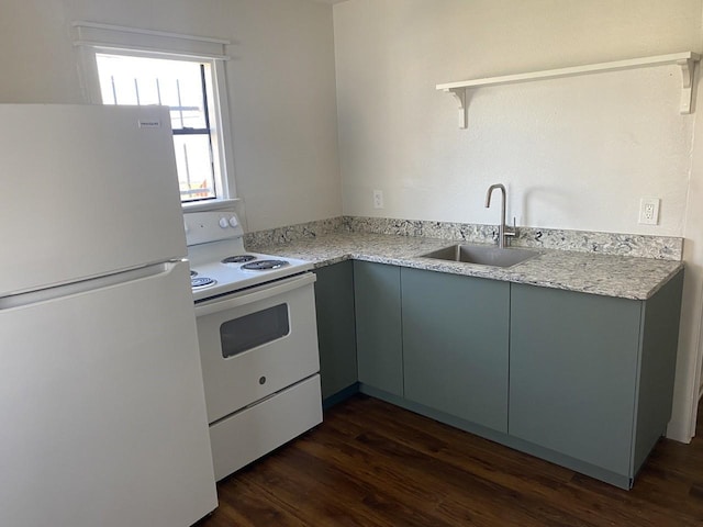 kitchen featuring dark hardwood / wood-style flooring, sink, and white appliances