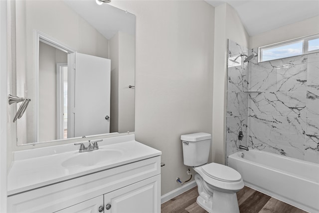 bathroom with toilet, shower / bath combination, wood finished floors, vanity, and baseboards