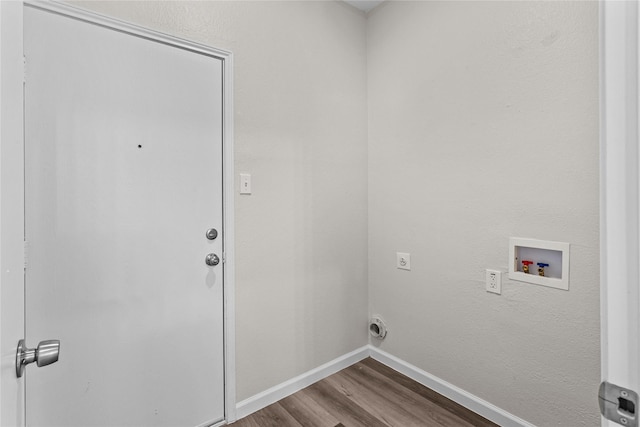 clothes washing area featuring laundry area, baseboards, wood finished floors, washer hookup, and electric dryer hookup