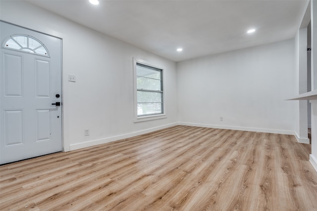 entryway with light hardwood / wood-style floors