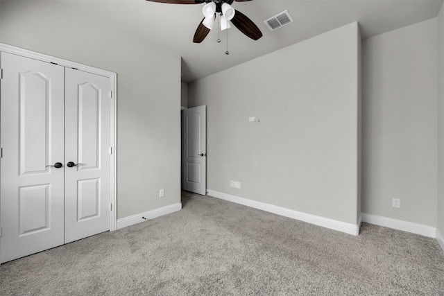 203 Half Moon Dr, Waxahachie, TX 75165 - unfurnished bedroom with visible vents, a closet, baseboards, ceiling fan, and carpet flooring