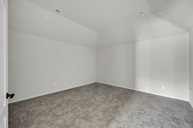 bonus room featuring carpet floors and vaulted ceiling