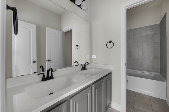 bathroom with vanity, tile patterned floors, and tiled shower / bath combo