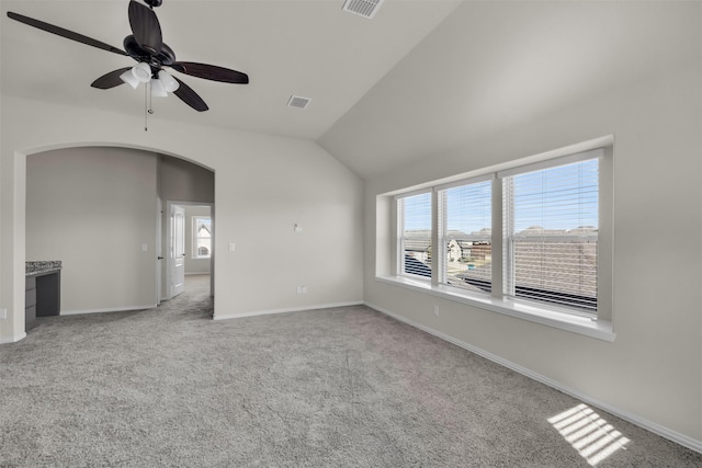 203 Half Moon Dr, Waxahachie, TX 75165 - interior space with visible vents, carpet flooring, ceiling fan, arched walkways, and vaulted ceiling