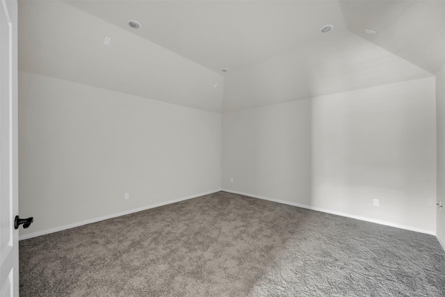 203 Half Moon Dr, Waxahachie, TX 75165 - spare room featuring carpet floors, baseboards, and vaulted ceiling