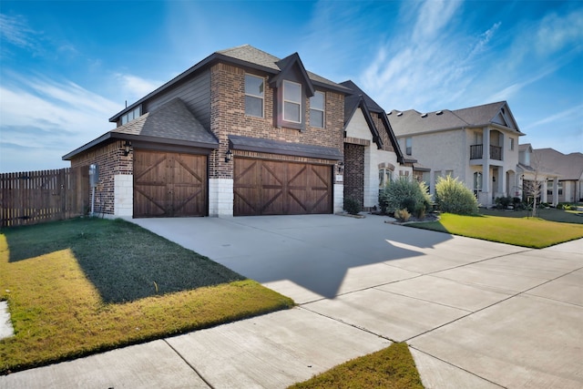 view of front of home with a front yard and a garage