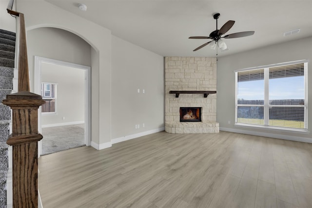 203 Half Moon Dr, Waxahachie, TX 75165 - unfurnished living room with ceiling fan, visible vents, a healthy amount of sunlight, and wood finished floors