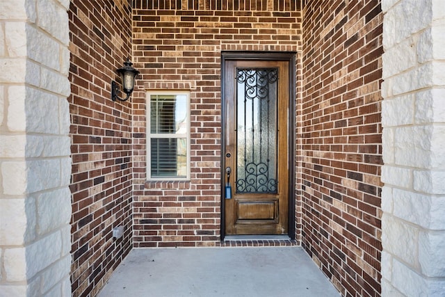 203 Half Moon Dr, Waxahachie, TX 75165 - doorway to property featuring brick siding