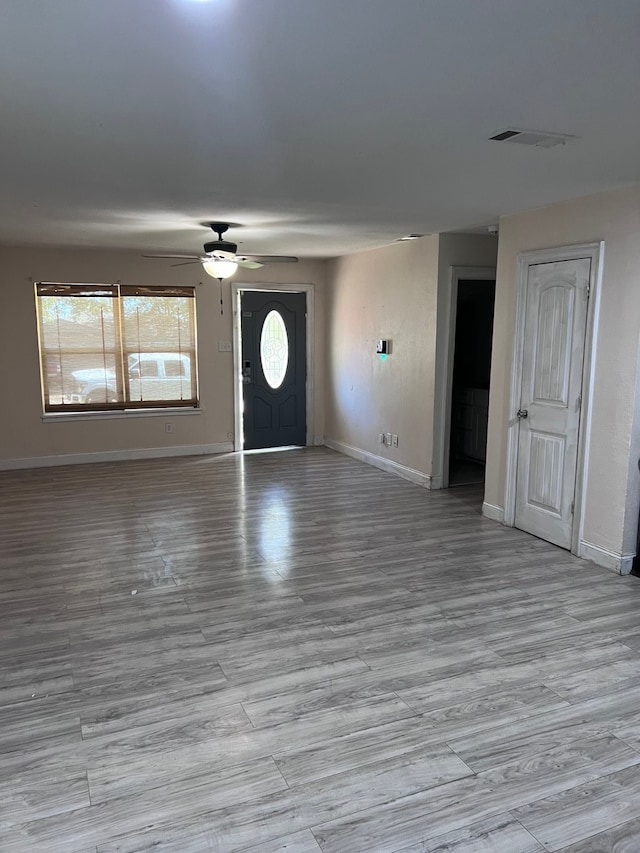 entrance foyer with light hardwood / wood-style floors and ceiling fan