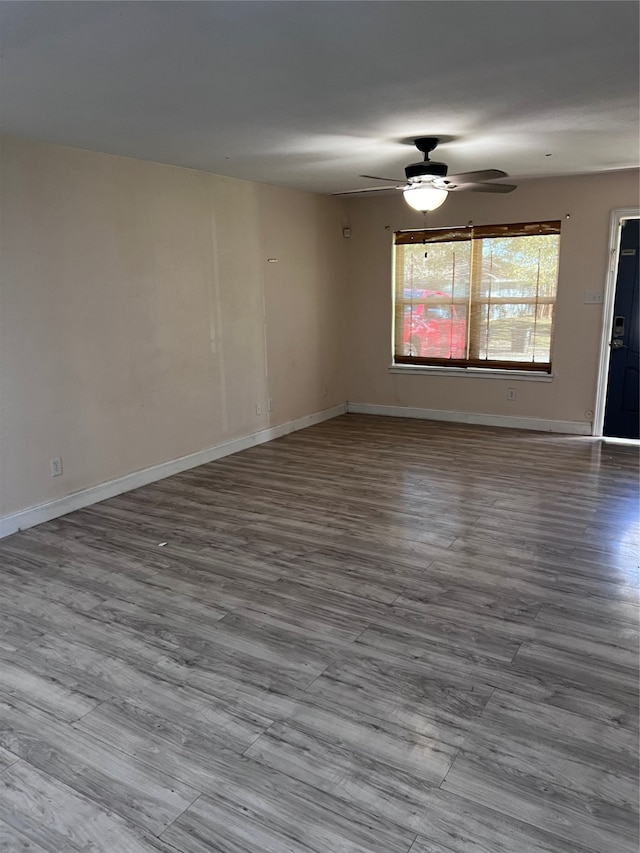 spare room featuring ceiling fan and light hardwood / wood-style floors