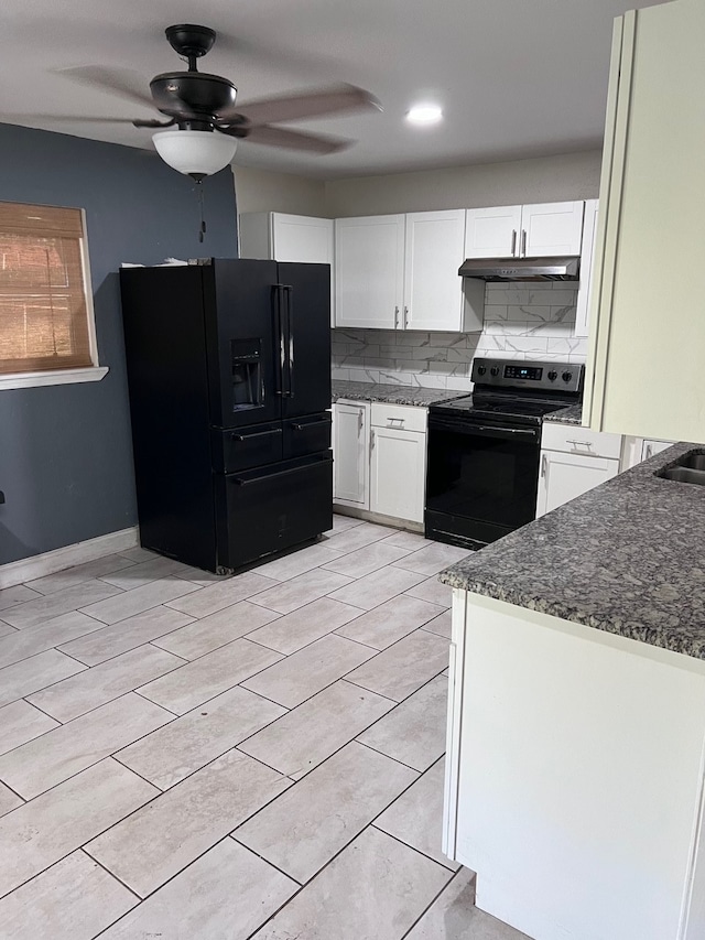 kitchen featuring black appliances, white cabinetry, dark stone counters, and decorative backsplash