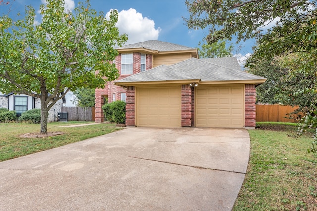 view of front of house featuring a garage and a front lawn