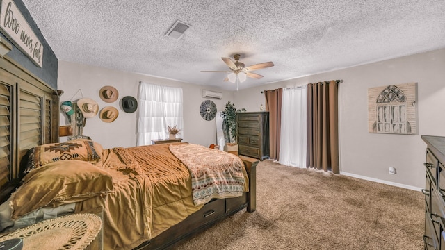 bedroom featuring an AC wall unit, a textured ceiling, ceiling fan, and carpet floors