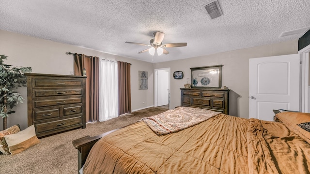 carpeted bedroom featuring a textured ceiling and ceiling fan