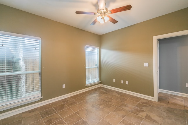 spare room with ceiling fan