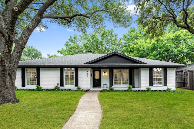 ranch-style house with a front lawn