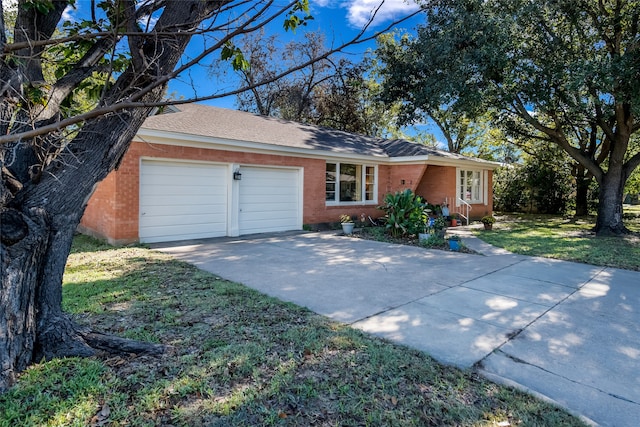 ranch-style home with a garage