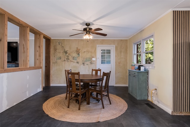 dining area featuring ornamental molding and ceiling fan