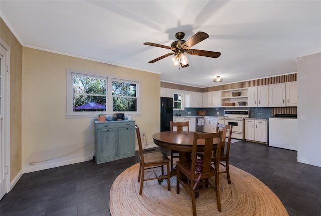 dining space with ornamental molding, sink, and ceiling fan