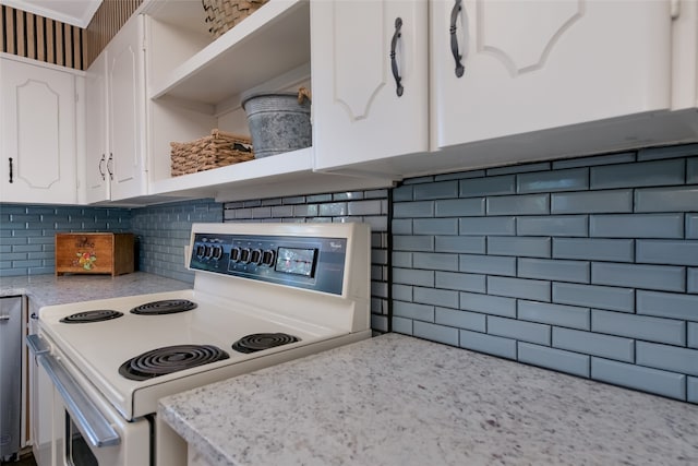 kitchen with white range with electric stovetop, decorative backsplash, light stone counters, and white cabinets