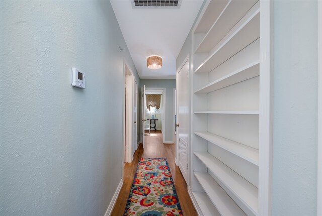 hall with light hardwood / wood-style flooring