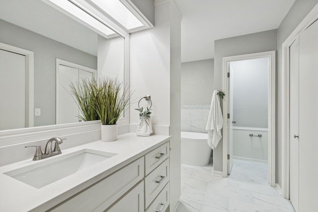 bathroom featuring a tub and vanity