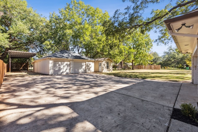 exterior space with an outbuilding and a garage