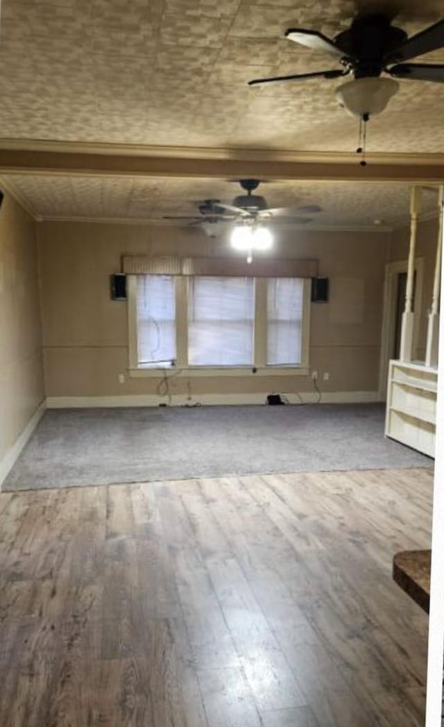 unfurnished room featuring ceiling fan, ornamental molding, and hardwood / wood-style floors