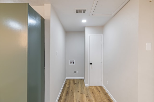 washroom with hookup for a washing machine, electric dryer hookup, and light hardwood / wood-style flooring