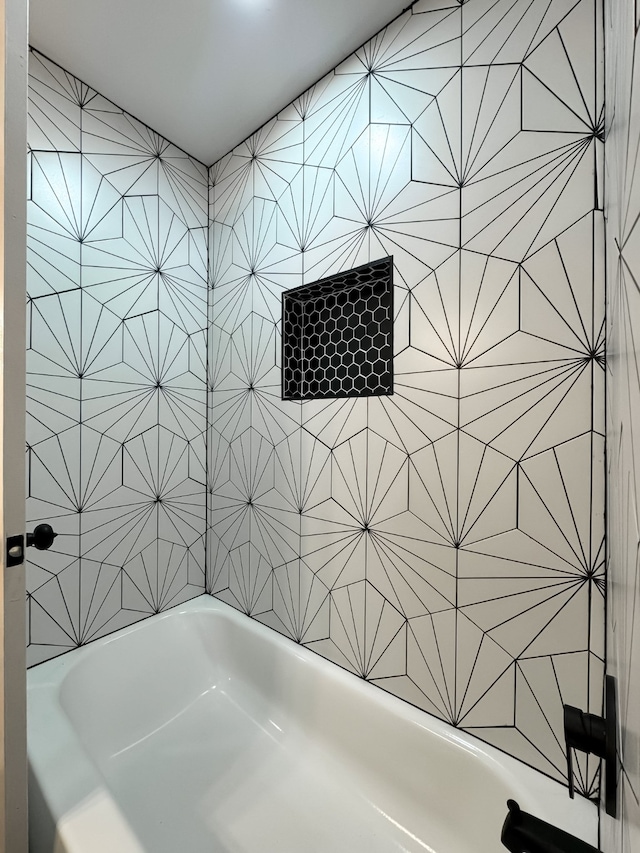 bathroom with a tub to relax in