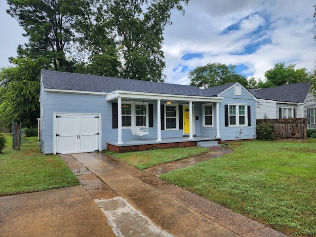 ranch-style home with a front yard and a porch