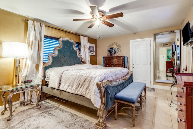 bedroom featuring ceiling fan and tile patterned flooring