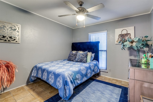 bedroom with ornamental molding, ceiling fan, and tile patterned floors